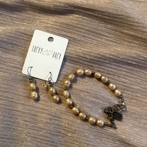 Gold Pearl bracelet and earrings.